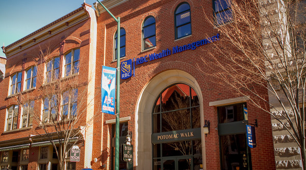 A brick building with an arched entrance labeled 