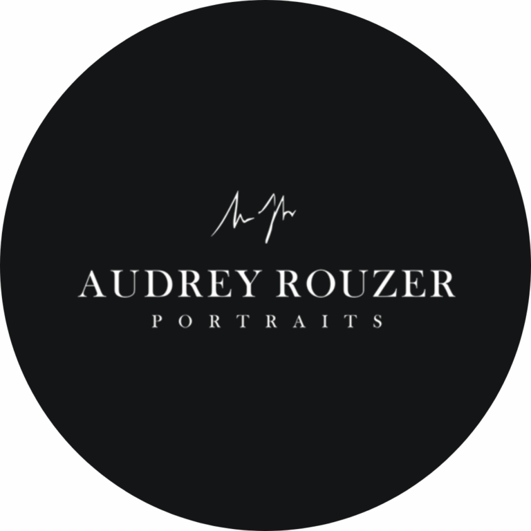 A black circular logo with white text reading 